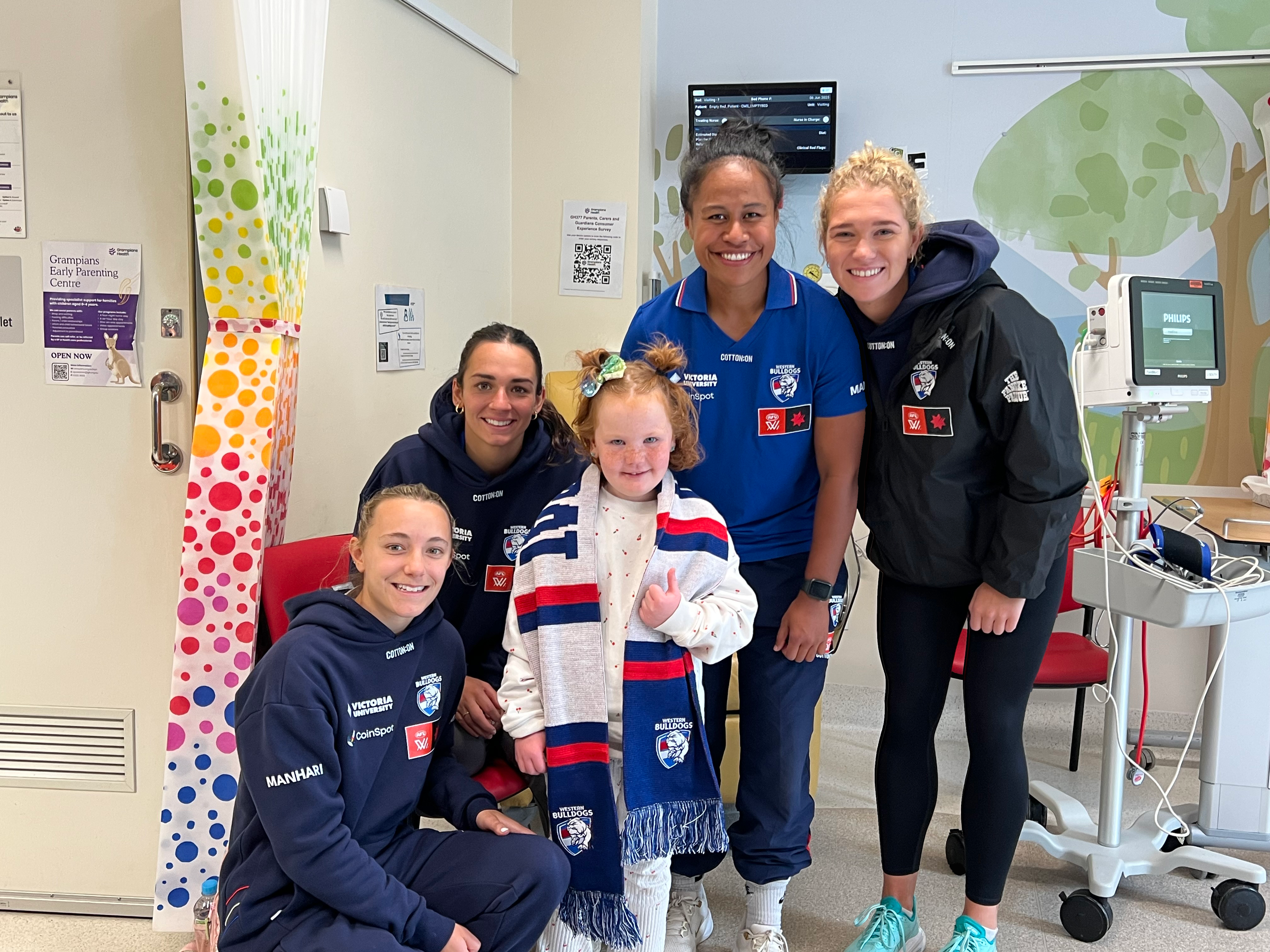 Western Bulldogs AFLW players Rylie Wilcox, Elisabeth Georgostathis, Vaomua Laloifi, and Analea McKee brought smiles and inspiration to the Children's Ward.