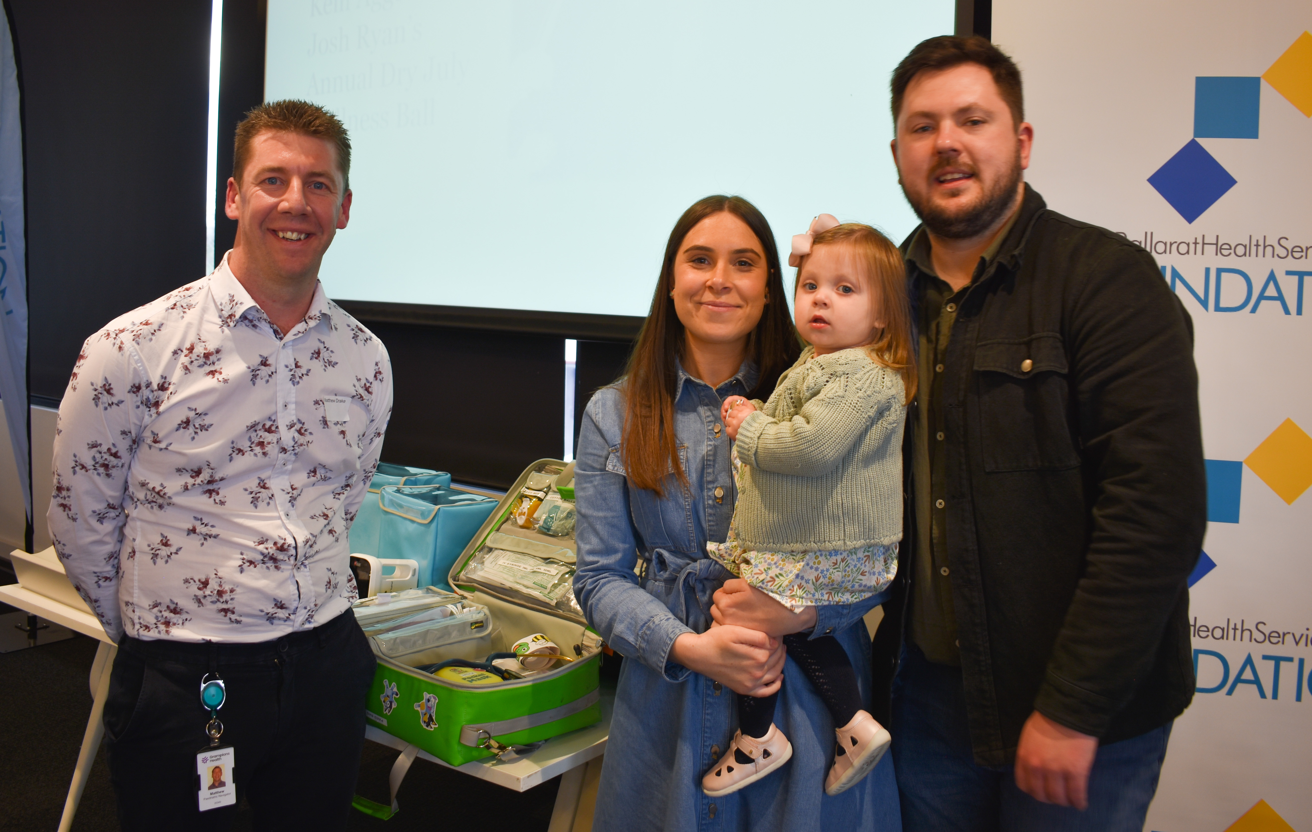 Matthew Drake, Paediatric Navigator Grampians Health at Home, with patient Lola Fennell and parents Jasmine Meier and Luke Funnell, and some of the equipment purchased through the 2023 Grampians Health Christmas Appeal.