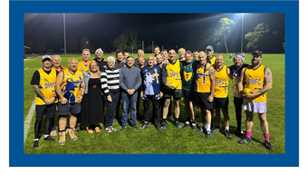 Masters AFL Footy team with Wellness Centre patients and staff
